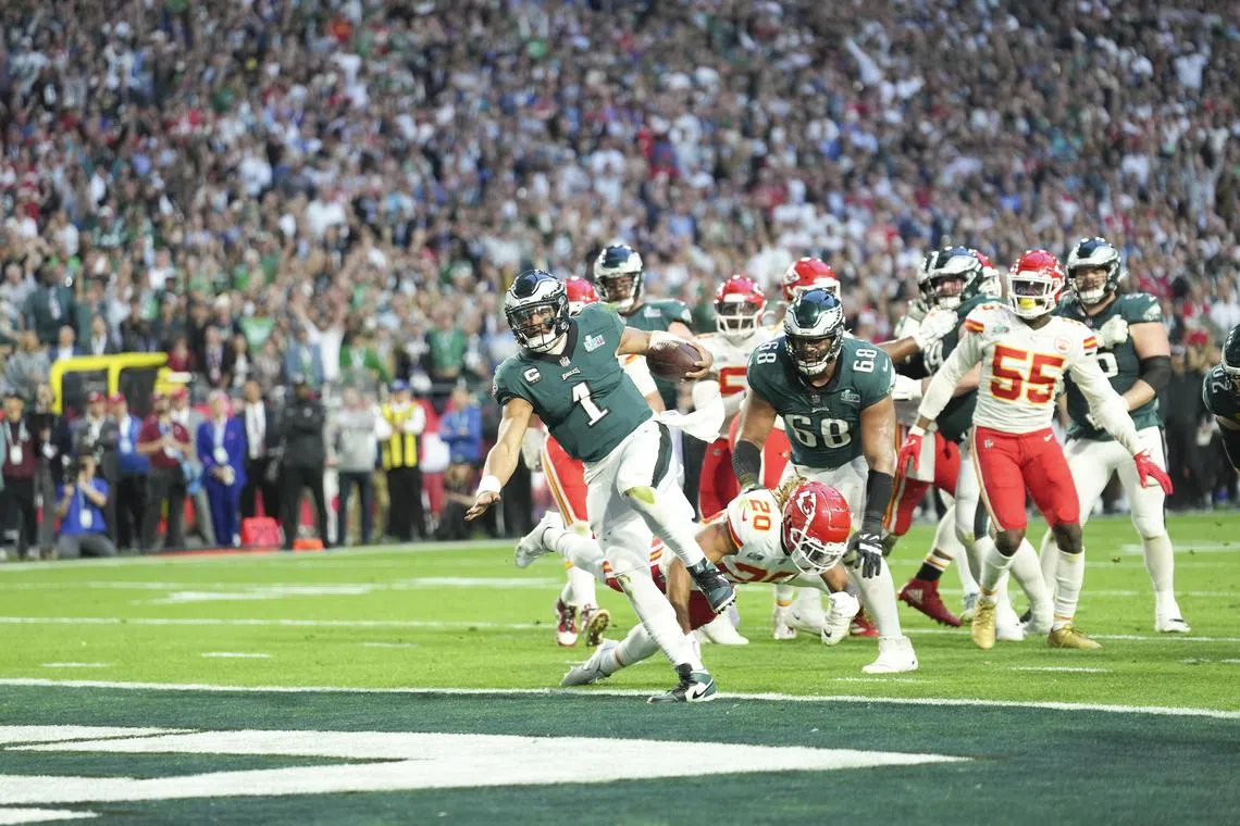 Philadelphia Eagles quarterback Jalen Hurts scoring a touchdown in the second quarter of Super Bowl LVII at State Farm Stadium on Sunday.