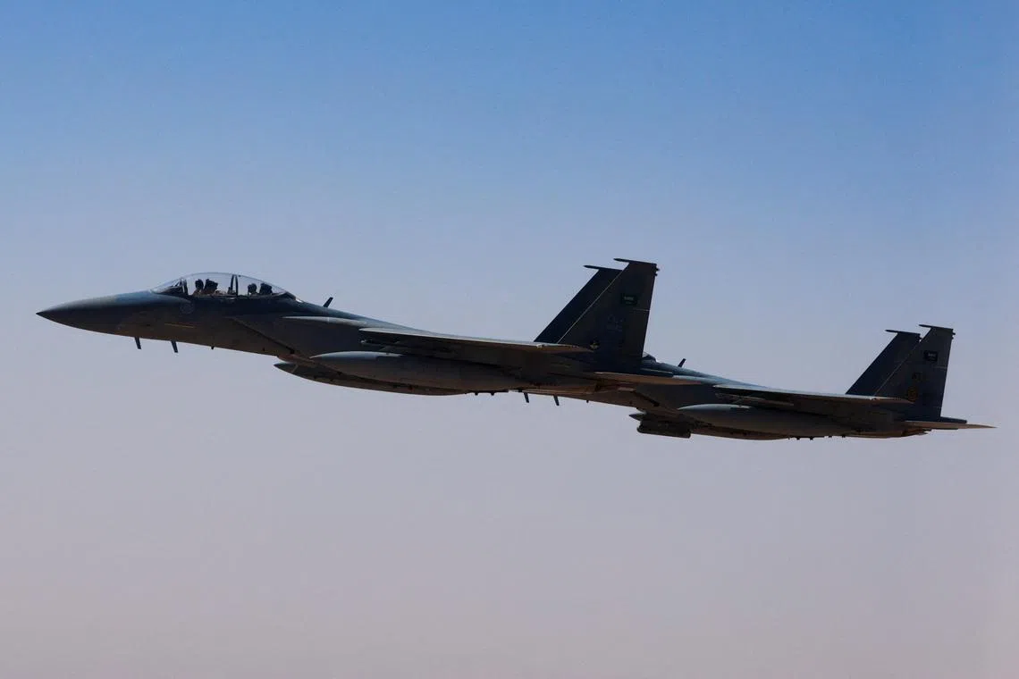 FILE PHOTO: A Saudi fighter jet accompanies Air Force One, carrying U.S. President Donald Trump, on approach to the King Khalid International Airport in Riyadh, Saudi Arabia, May 13, 2025. REUTERS/Brian Snyder/File Photo