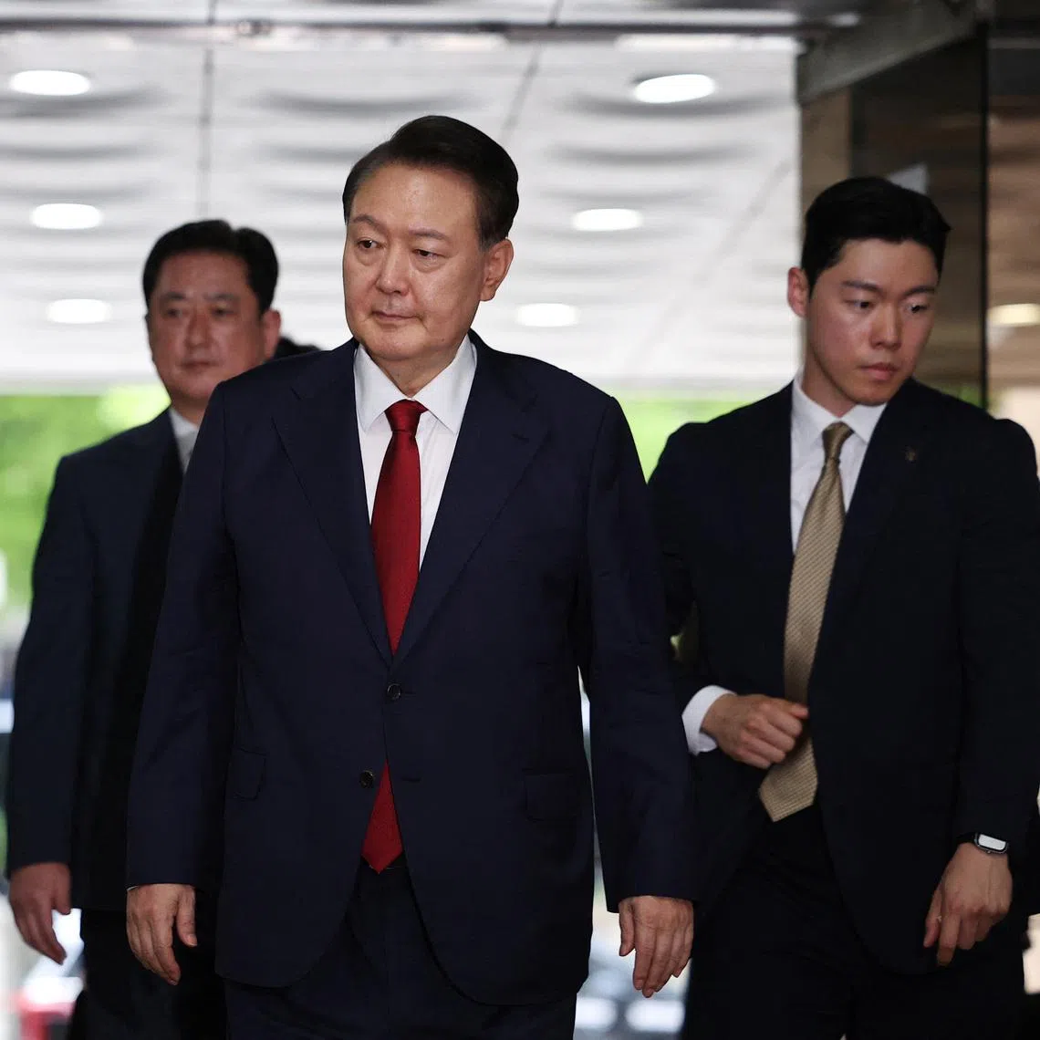 Former South Korean President Yoon Suk Yeol arrives at a court to attend a hearing to review his arrest warrant requested by special prosecutors in Seoul, South Korea, July 9, 2025. 