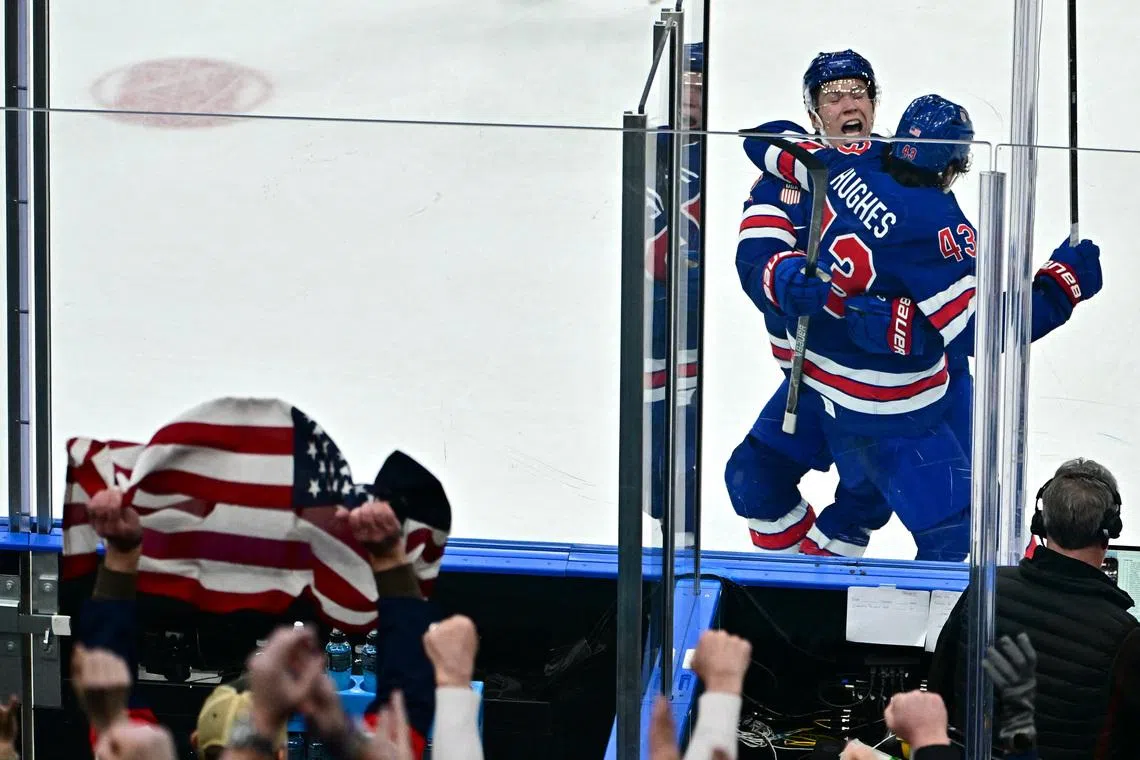 Milano Cortina 2026 Olympics - Ice Hockey - Men's Play-offs Quarterfinals - United States vs Sweden - Milano Santagiulia Ice Hockey Arena, Milan, Italy - February 18, 2026. Quinn Hughes of United States celebrates after scoring their second goal in overtime to win the match REUTERS/Marton Monus