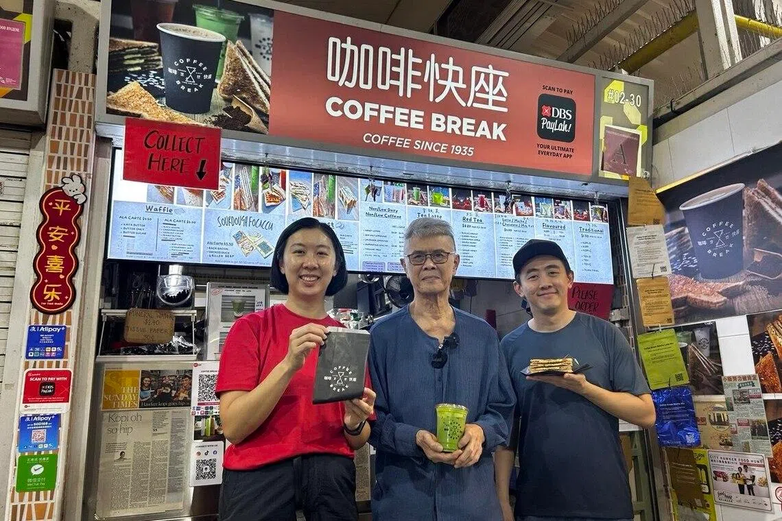 Siblings Faye (left) and Jack (right) Sai, with their father Sai Tok Tan, pictured in front of their Holland Drive stall.