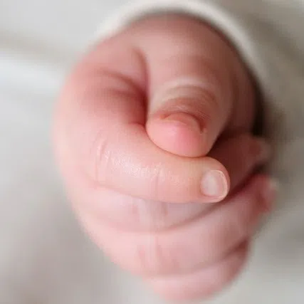 The baby is estimated to be less than one year old.