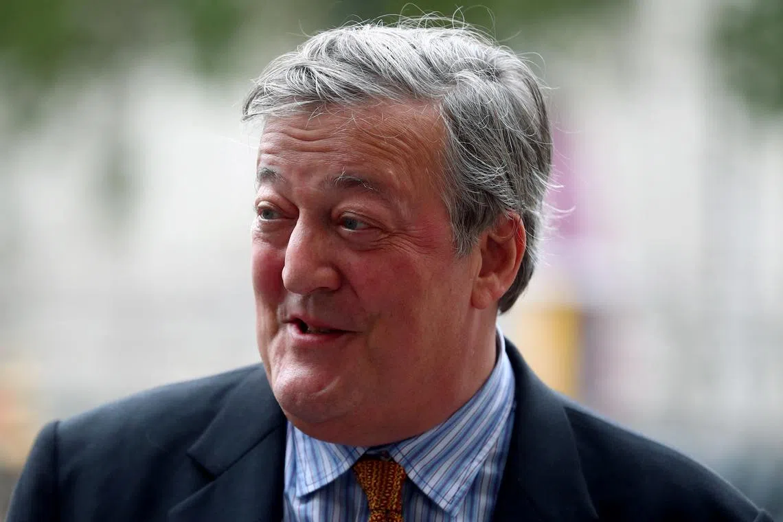FILE PHOTO: Actor Stephen Fry attends a Service of Thanksgiving for Sir Peter Hall at Westminster Abbey in London, Britain, September 11, 2018. REUTERS/Hannah McKay/File Photo