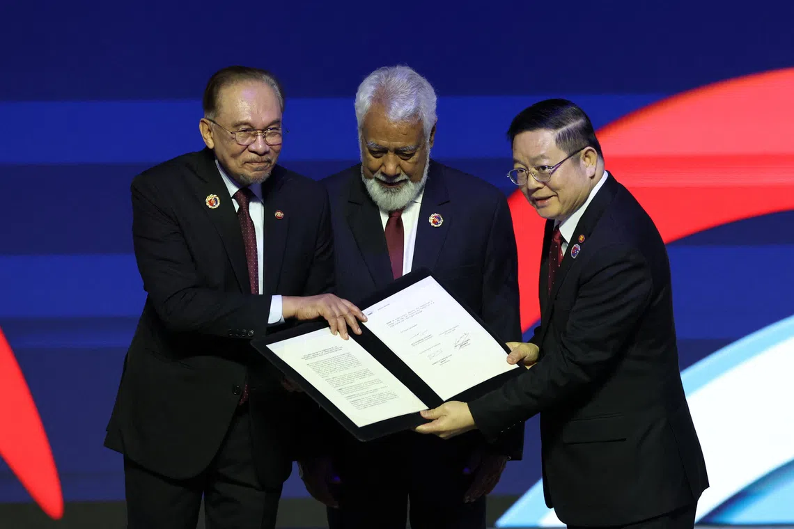 Malaysia's Prime Minister Anwar Ibrahim (left), China’s Premier Li Qiang (right) and Timor-Leste's Prime Minister Kay Rala Xanana Gusmao during the signing ceremony on Oct 26.