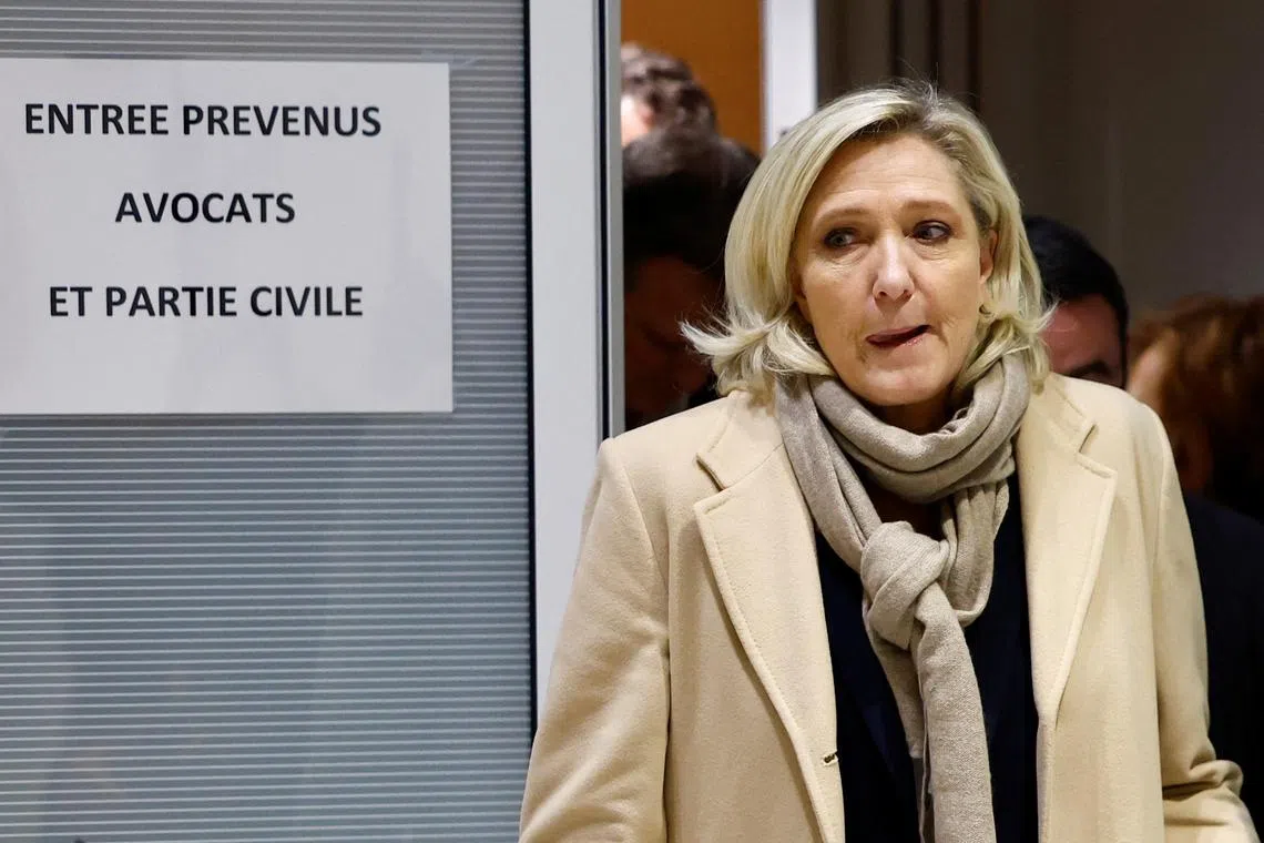 FILE PHOTO: French far-right leader Marine Le Pen, member of parliament of the Rassemblement National (National Rally - RN) party, leaves on the last day of her trial alongside 24 other defendants (party officials and employees, former lawmakers and parliamentary assistants) and the RN party itself, over alleged misappropriation of European Union funds, using money intended to pay FN-RN parliamentary assistants for party staff between 2004 and 2016, at the courthouse in Paris, France, November 27, 2024. REUTERS/Stephanie Lecocq/File Photo