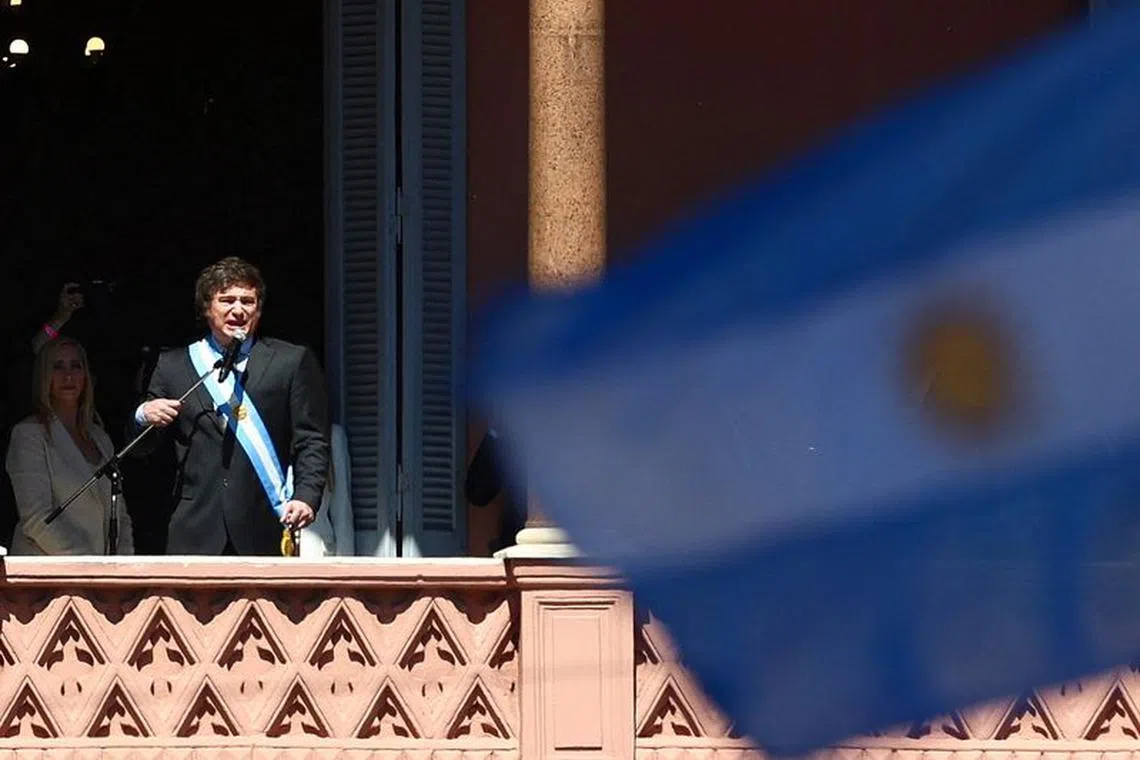 Argentina's President Javier Milei addresses supporters gathered outside Casa Rosada after his swearing-in ceremony, in Buenos Aires, Argentina December 10, 2023. REUTERS/Matias Baglietto/File Photo