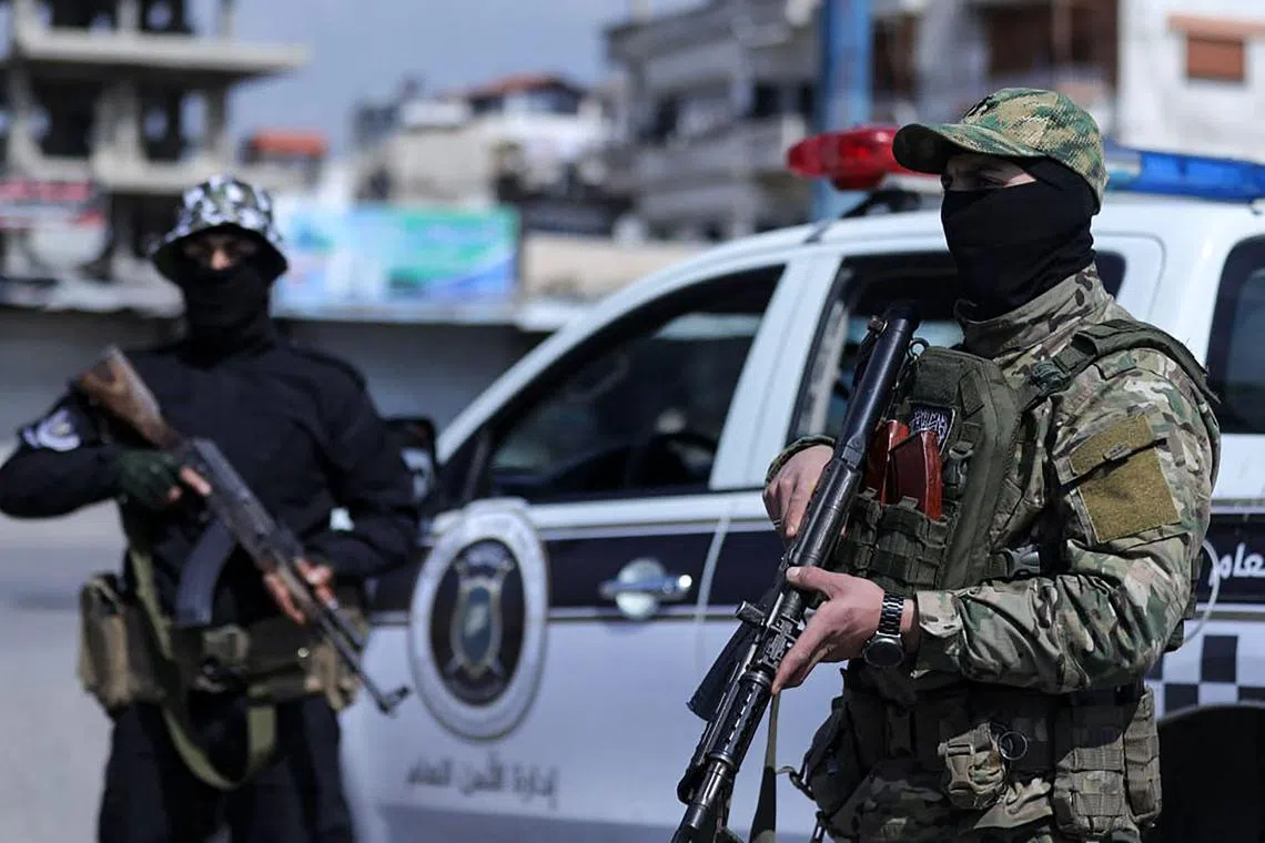 Syrian forces man a checkpoint in the coastal city of Latakia.