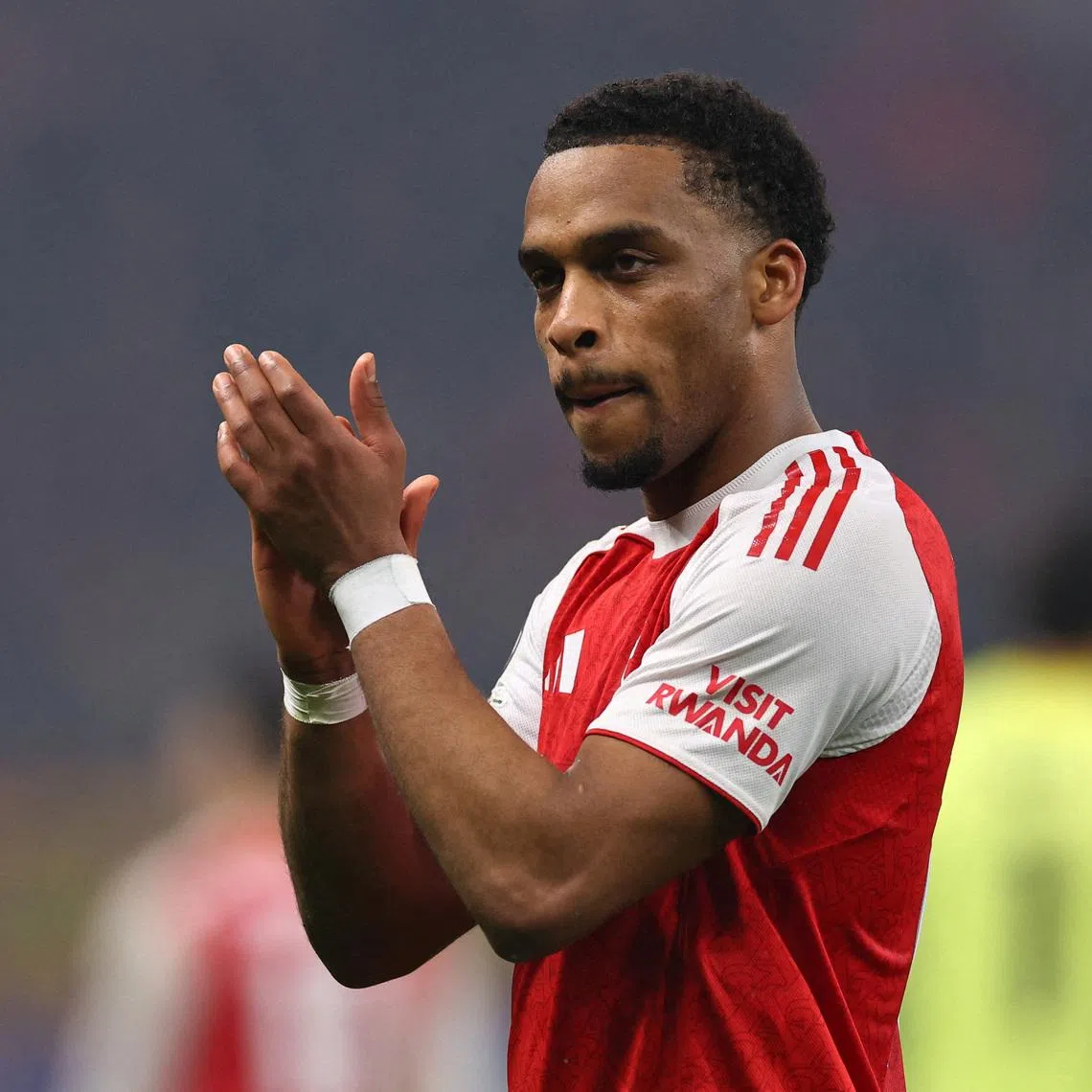 FILE PHOTO: Soccer Football - UEFA Champions League - Round 16 - First Leg - Bayer Leverkusen v Arsenal - BayArena, Leverkusen, Germany - March 11, 2026 Arsenal's Jurrien Timber applauds fans after the match REUTERS/Wolfgang Rattay/File Photo
