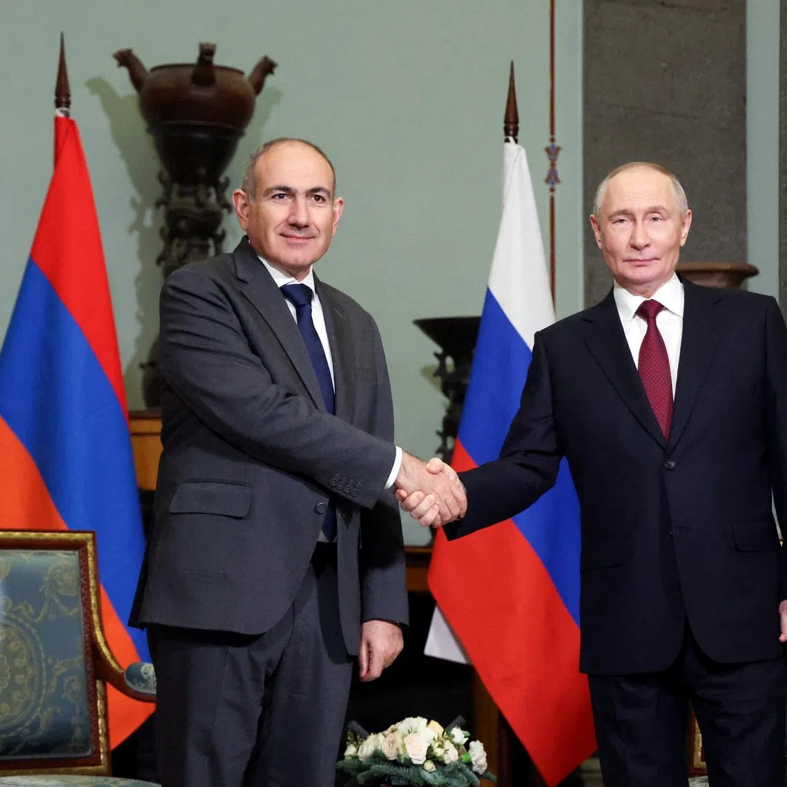FILE PHOTO: Russian President Vladimir Putin shakes hands with Armenian Prime Minister Nikol Pashinyan during a meeting on the sidelines of an informal summit of leaders of nations, which are members of the Commonwealth of Independent States (CIS), in Saint Petersburg, Russia, December 22, 2025. Sputnik/Alexander Kazakov/Pool via REUTE/File Photo