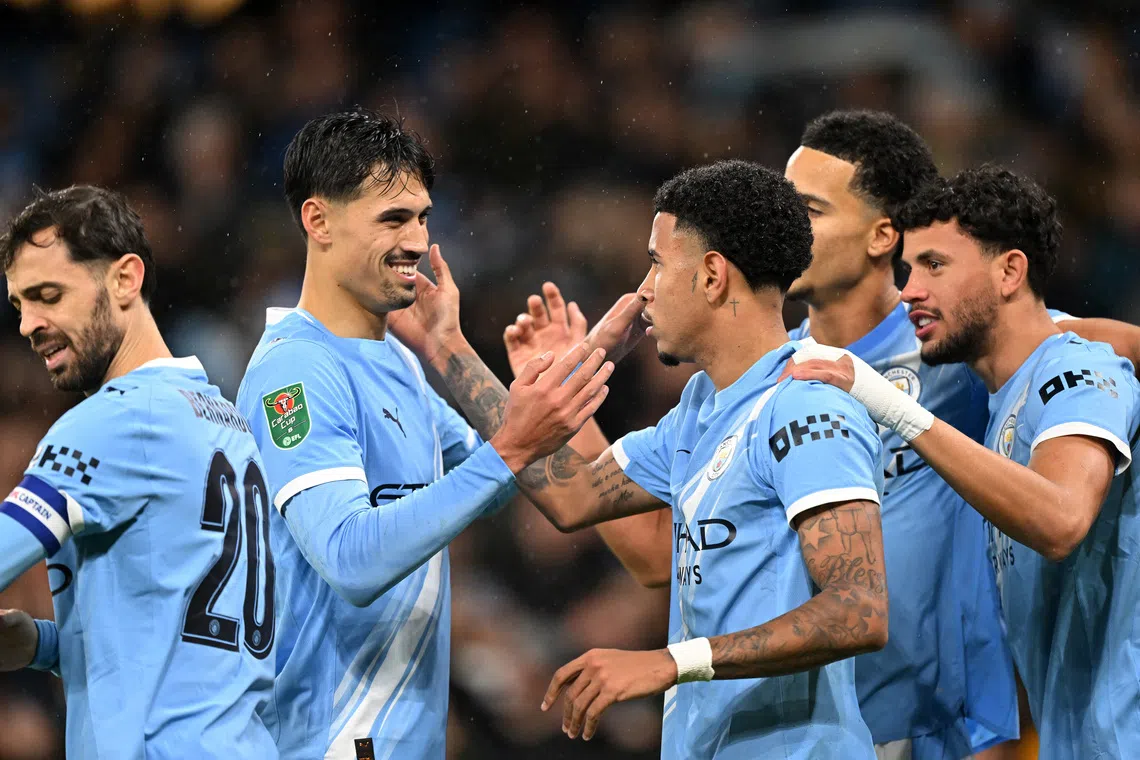 Soccer Football - Carabao Cup - Quarter Final - Manchester City v Brentford - Etihad Stadium, Manchester, Britain - December 17, 2025   Manchester City's Savinho celebrates scoring their second goal with teammates REUTERS/Peter Powell