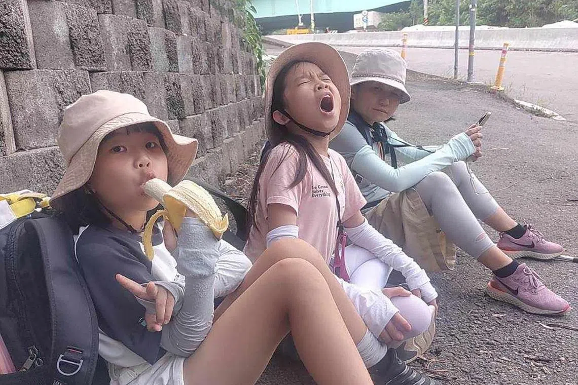 Ms Hung Li-ping and her daughters in the middle of their huandao journey by foot, which they hope to complete by the end of the year.