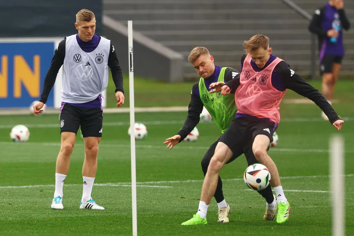 Soccer Football - International Friendly - Germany Training - DFB Campus, Frankfurt, Germany - March 19, 2024 Germany's Toni Kroos with Maximilian Mittelstadt and Maximilian Beier during training REUTERS/Kai Pfaffenbach