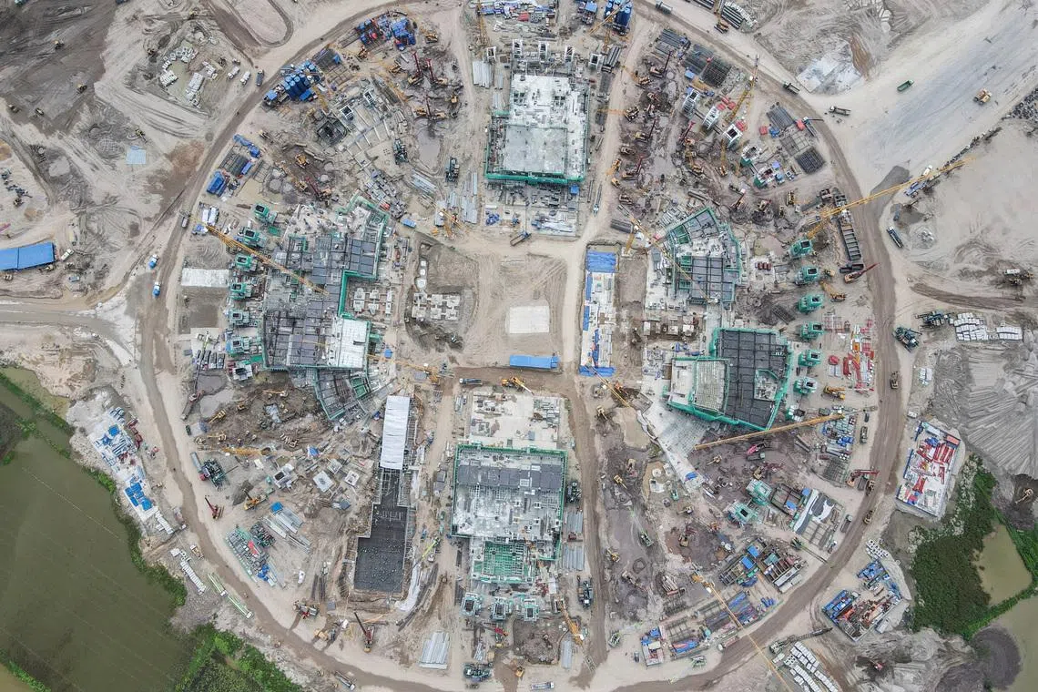 A drone view shows construction work at Hung Vuong Stadium, a planned 135,000-seat football stadium, in Hanoi, Vietnam, on June 8.