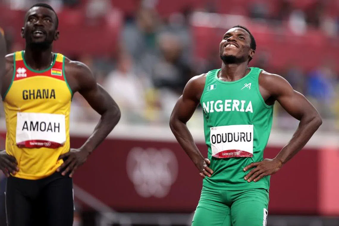 FILE PHOTO:Tokyo 2020 Olympics - Athletics - Men's 200m - Semifinal - Olympic Stadium, Tokyo, Japan - August 3, 2021. Divine Oduduru of Nigeria after competing in Semifinal 1 REUTERS/Hannah Mckay/File Photo