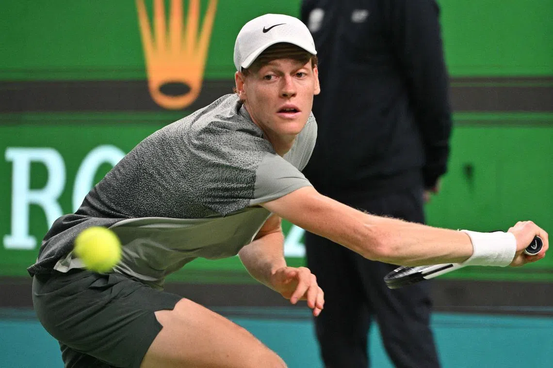 Italy's Jannik Sinner hits a return to Czech Republic's Tomas Machac during their semi-final match at the Shanghai Masters.