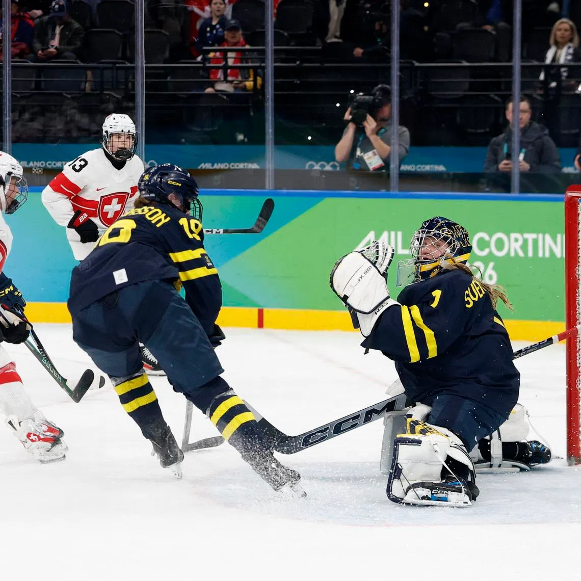 Milano Cortina 2026 Olympics - Ice Hockey - Women's Bronze Medal Game - Switzerland vs Sweden - Milano Santagiulia Ice Hockey Arena, Milan, Italy - February 19, 2026. Alina Muller of Switzerland scores their second goal past Ebba Svensson Traff of Sweden in overtime to win bronze REUTERS/David W Cerny
