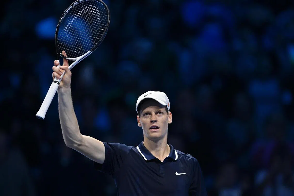 Italy's Jannik Sinner of Italy celebrates winning his Round Robin match against Daniil Medvedev.