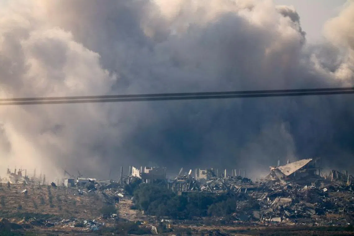 Smoke from an explosion rises in Gaza, after a temporary truce between Israel and the Palestinian Islamist group Hamas expired, as seen from southern Israel, December 2, 2023. REUTERS/Alexander Ermochenko