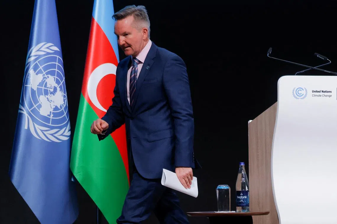 Australia's Minister for Climate Change and Energy Chris Bowen walks on stage after he delivered a statement during the United Nations climate change conference COP29, in Baku, Azerbaijan November 19, 2024 REUTERS/Maxim Shemetov