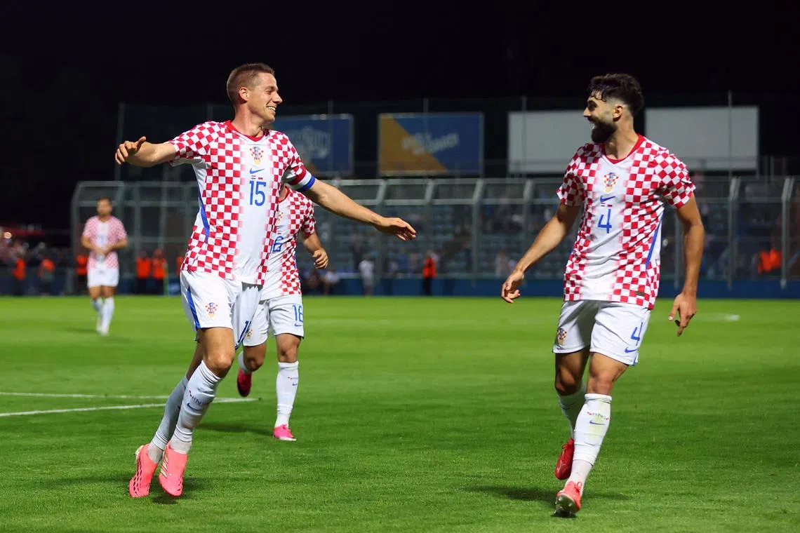 Soccer Football - International Friendly - Croatia v Slovenia - Stadion Varteks, Varazdin, Croatia - June 7, 2026 Croatia's Mario Pasalic celebrates scoring their second goal with Josko Gvardiol REUTERS/Antonio Bronic