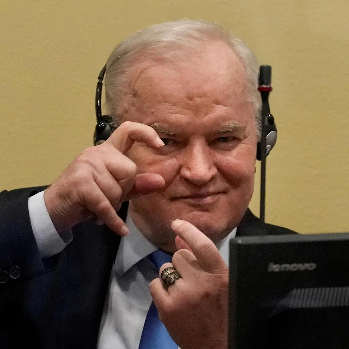 A 2021 photo shows former Bosnian Serb military leader Ratko Mladic gesturing at a hearing in The Hague, Netherlands.