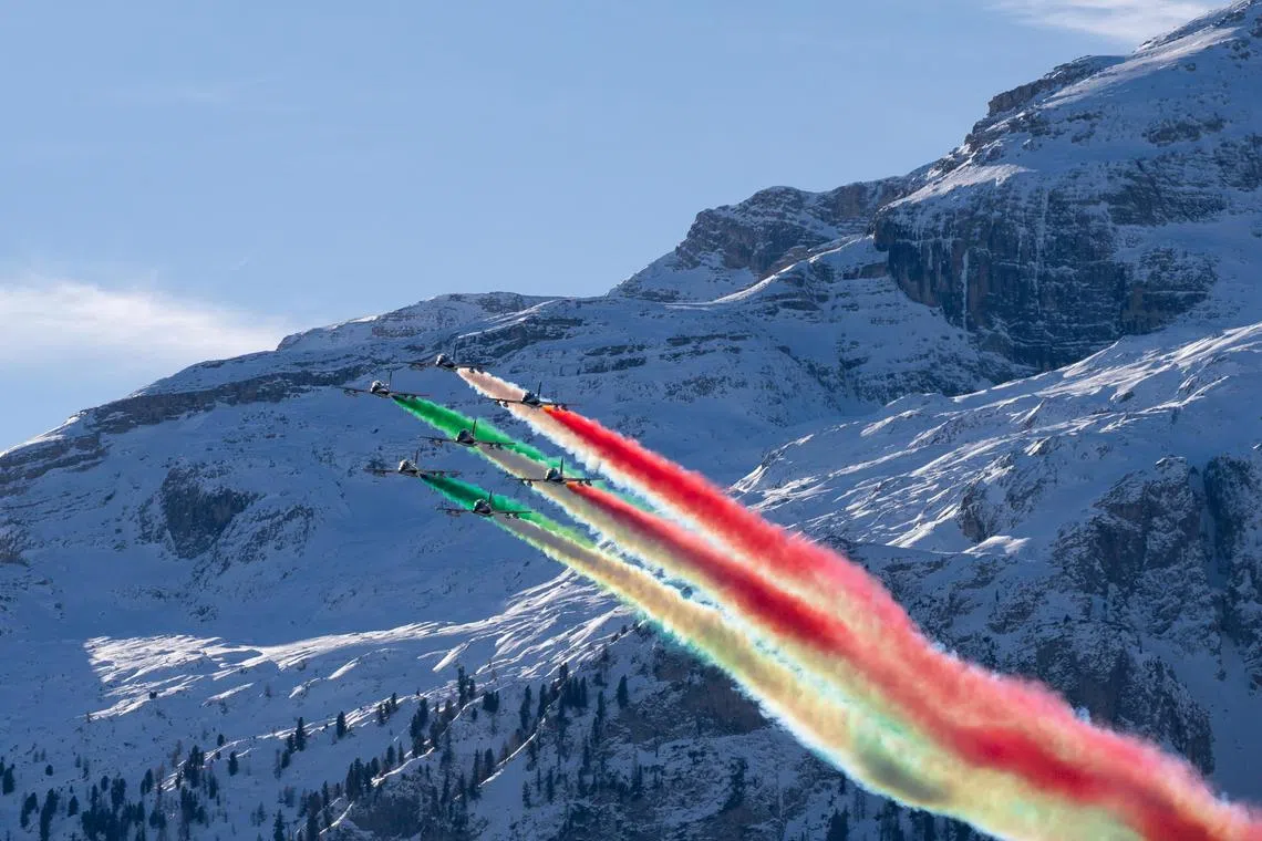 The Italian Frecce Tricolori aerobatic team is performing before the second run of the Men's Giant Slalom race in the Alpine Skiing World Cup in Alta Badia, Italy on Dec17, 2023.