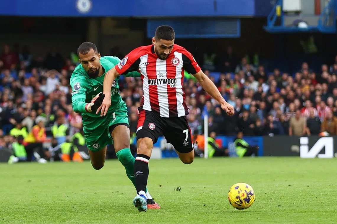 Chelsea goalkeeper Robert Sanchez unable to stop Brentford striker Neal Maupay from passing to teammate Bryan Mbeumo to prod the ball into an empty net, as the Bees won their English Premier League clash 2-0 at Stamford Bridge on Saturday.