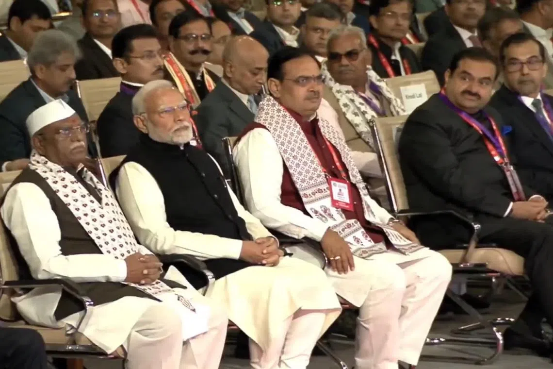 Indian Prime Minister Narendra Modi (second from left) and Gautam Adani (second from right) attending the Rising Rajasthan Global Investment Summit in Jaipur on Dec. 9. 