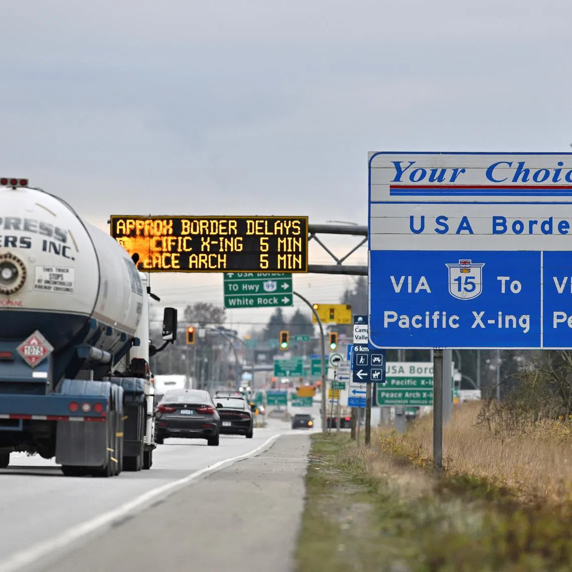 FILE PHOTO: Commercial trucks head towards the U.S. Customs and Border Protection (CBP) Pacific Highway Port of Entry from south Surrey, British Columbia, Canada, November 26, 2024.  REUTERS/Jennifer Gauthier/File Photo