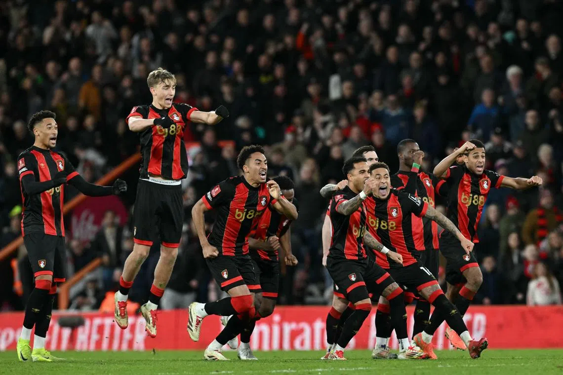 Bournemouth's players react after Wolverhampton Wanderers' Malian midfielder #06 Boubacar Traore misses his kick in the penalty shootout in the English FA Cup fifth round football match between AFC Bournemouth and Wolverhampton Wanderers at the Vitality Stadium in London on March 1, 2025. Bournemouth won the game 5-4 on penalties after the game finished 1-1 after extra time. 