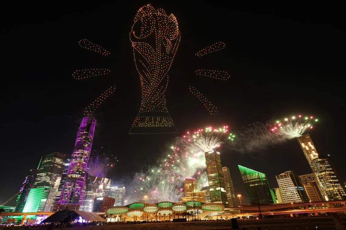 Soccer Football - FIFA confirm Saudi Arabia as 2034 World Cup hosts, Riyadh, Saudi Arabia - December 11, 2024 A drone show is seen displaying the FIFA World Cup Trophy as Saudi Arabia is announced as the host nation for the FIFA World Cup 2034 Saudi Arabia Football Association/Handout via REUTERS