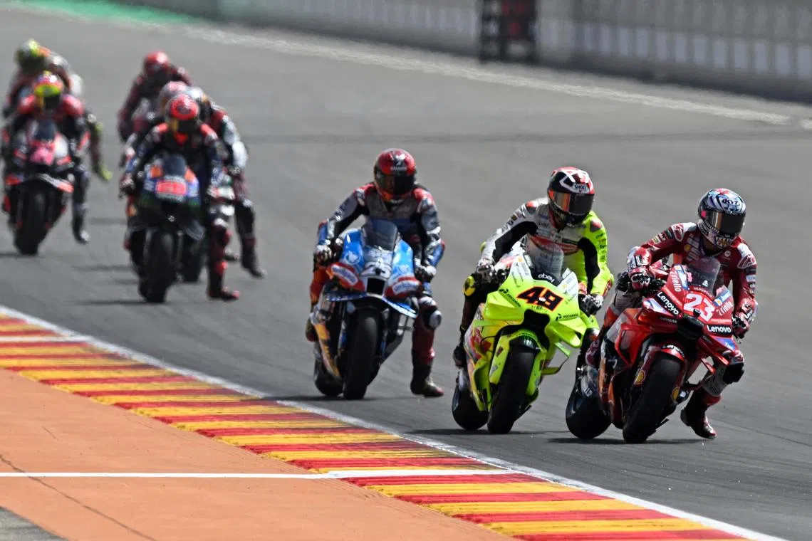 FILE PHOTO: MotoGP - Aragon Grand Prix - Ciudad del Motor de Aragon, Alcaniz, Spain - September 1, 2024 Ducati Lenovo Team's Enea Bastianini, Pertamina Enduro VR46 Racing Team's Fabio Di Giannantonio, Trackhouse Racing's Raul Fernandez and riders in action during the MotoGP REUTERS/Pablo Morano/File Photo