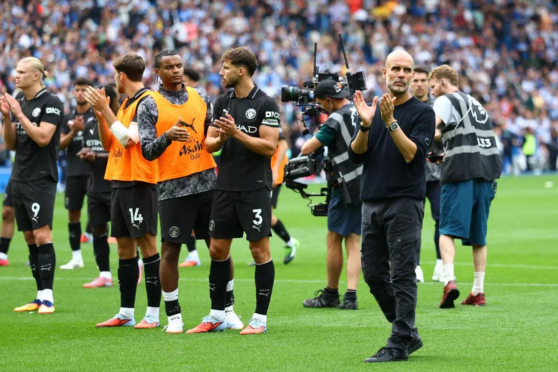 Manchester City manager Pep Guardiola looks dejected as he applauds fans after the loss to Brighton & Hove Albion the last time out.