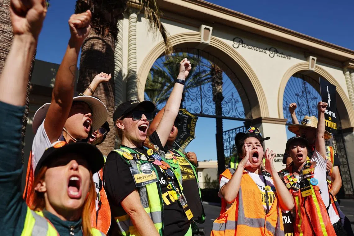 SAG-Aftra members chant outside Paramount Studios on day 118 of their strike against the Hollywood studios on Nov 8, 2023 in Los Angeles, California. A tentative labour agreement has been reached between the actors union and the Alliance of Motion Picture and Television Producers with the strike set to end after midnight.   