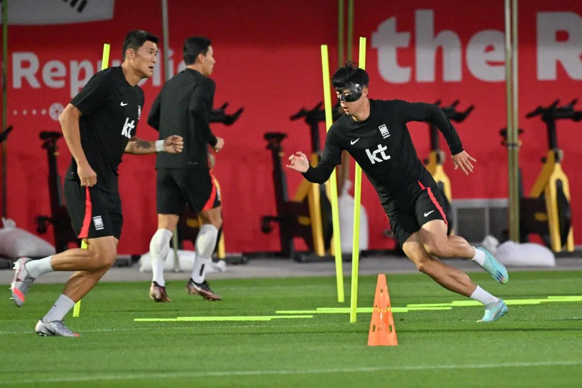 Son Heung-min (right) at a training session in Doha on Nov 22, 2022.