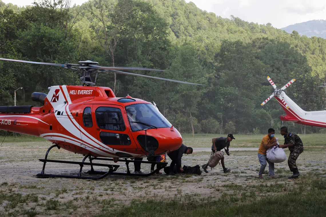 People rescued and airlifted from flood-affected areas arrive at Maithali Barrack, an army training centre, which serves as a primary base to airlift survivors following flash floods and mudslide at Trishuli in Nuwakot district, Nepal, August 27, 2026. REUTERS/Navesh Chitrakar