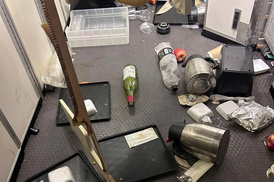 The interior of Singapore Airlines flight SQ321 is pictured after an emergency landing at Bangkok's Suvarnabhumi International Airport.