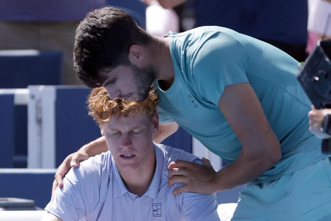 Spain's Carlos Alcaraz (right) consoling Italy's Jannik Sinner on Aug 18 in Cincinnati after Sinner retired at 0-5 in the first set due to illness.