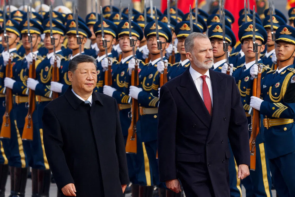 Spain's King Felipe (right) and Chinese President Xi Jinping attending a welcoming ceremony at the Great Hall of the People in Beijing, China on Nov 12. 