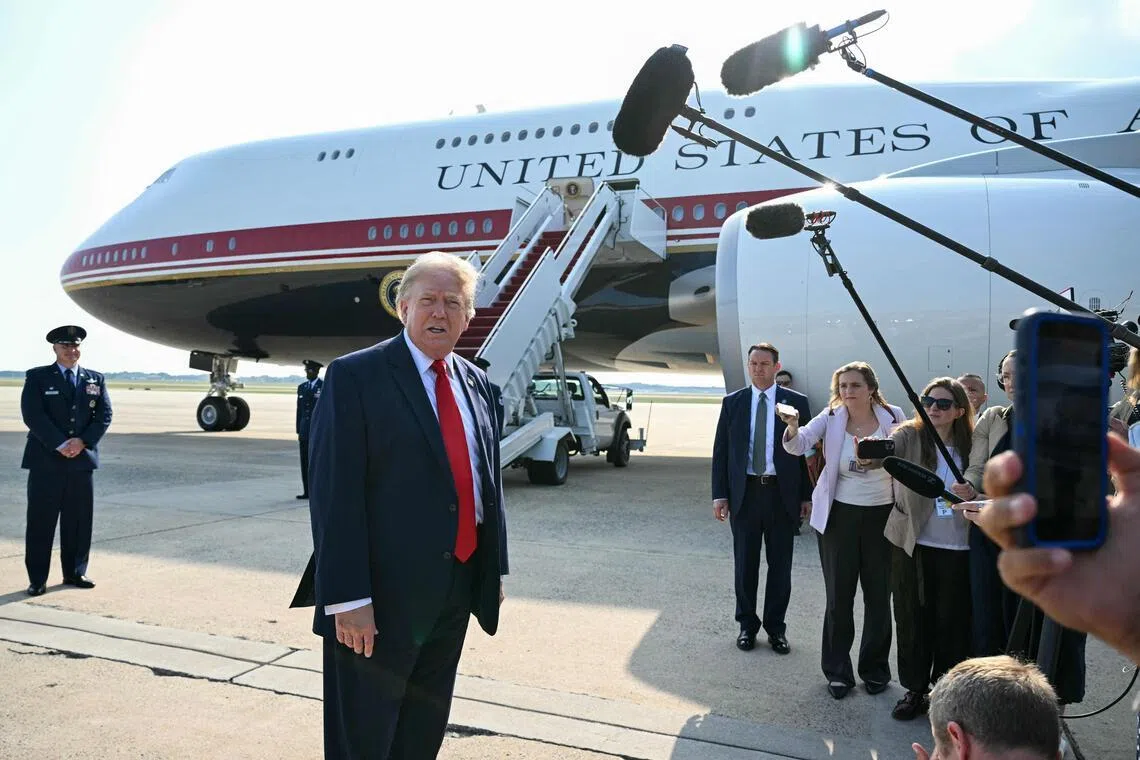 TOPSHOT - US President Donald Trump speaks to the press before he boards Air Force One for his first flight aboard the Boeing 747-8 that Qatar gifted the United States to use for executive travel, at Joint Base Andrews, in Maryland, July 1, 2026. President Trump is traveling to Medora, North Dakota to participate in the Theodore Roosevelt Presidential Library Opening Ceremony. (Photo by SAUL LOEB / AFP)