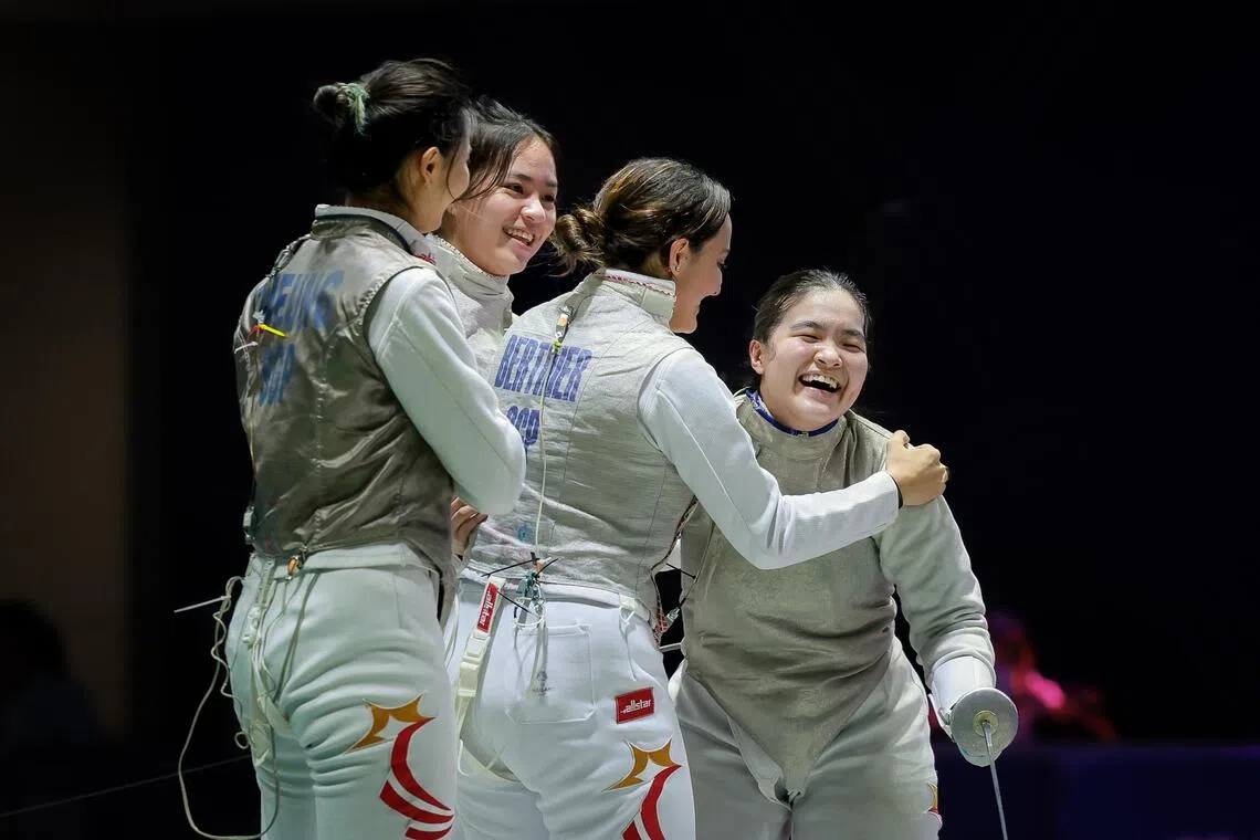 (From left) Singapore fencers Cheung Kemei, Stephanie Lee, Amita Berthier and Maxine Wong celebrating after winning the women’s foil team final. Their victory helped Singapore’s fencing squad secure a record haul of eight gold medals at the SEA Games, surpassing their previous best from 2023.