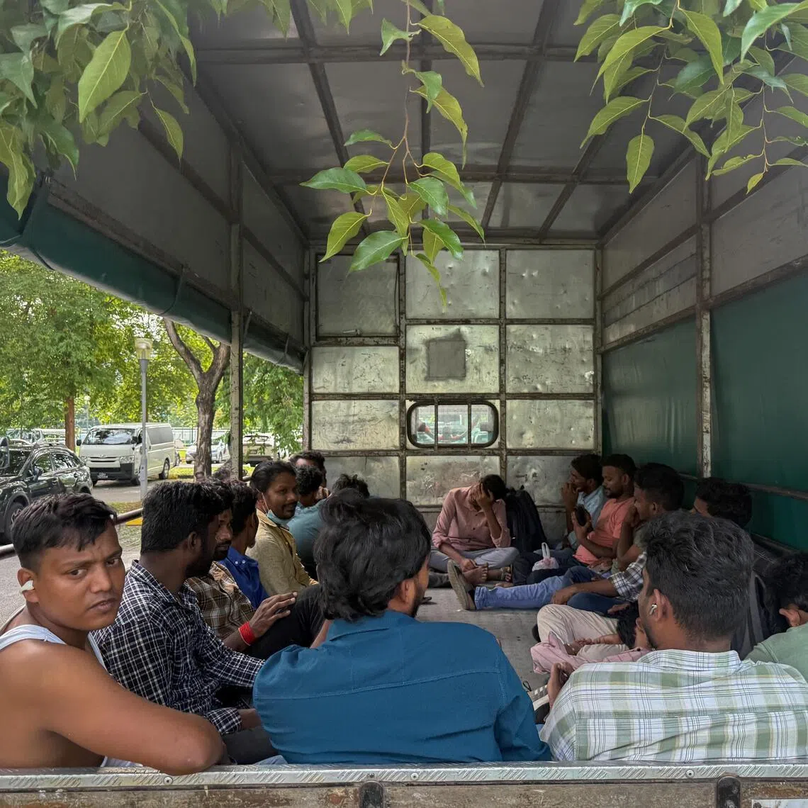 Workers from KPA Engineering in a lorry near the MOM Services Centre in Bendemeer on June 23.