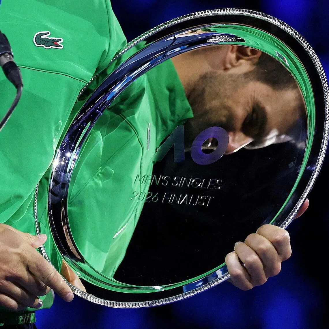 Novak Djokovic, 10-time champion at the Australian Open, holding a rare piece of silver: The runner's up trophy. 
