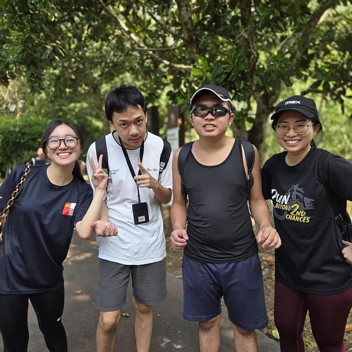 Eden Friendship Club members spend time with National Junior College student volunteers.