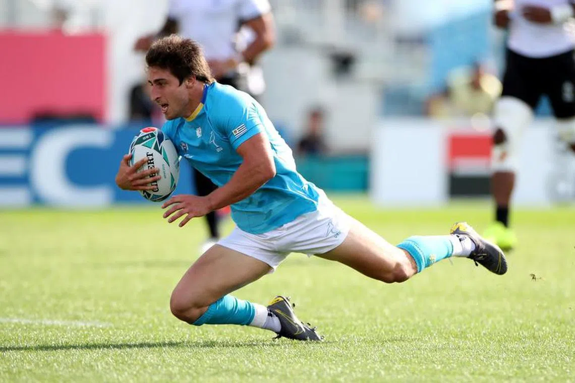 Rugby Union - Rugby World Cup 2019 - Pool D - Fiji v Uruguay - Kamaishi Recovery Memorial Stadium, Kamaishi, Japan - September 25, 2019  Uruguay's Santiago Arata scores their first try.   REUTERS/Peter Cziborra/File Photo