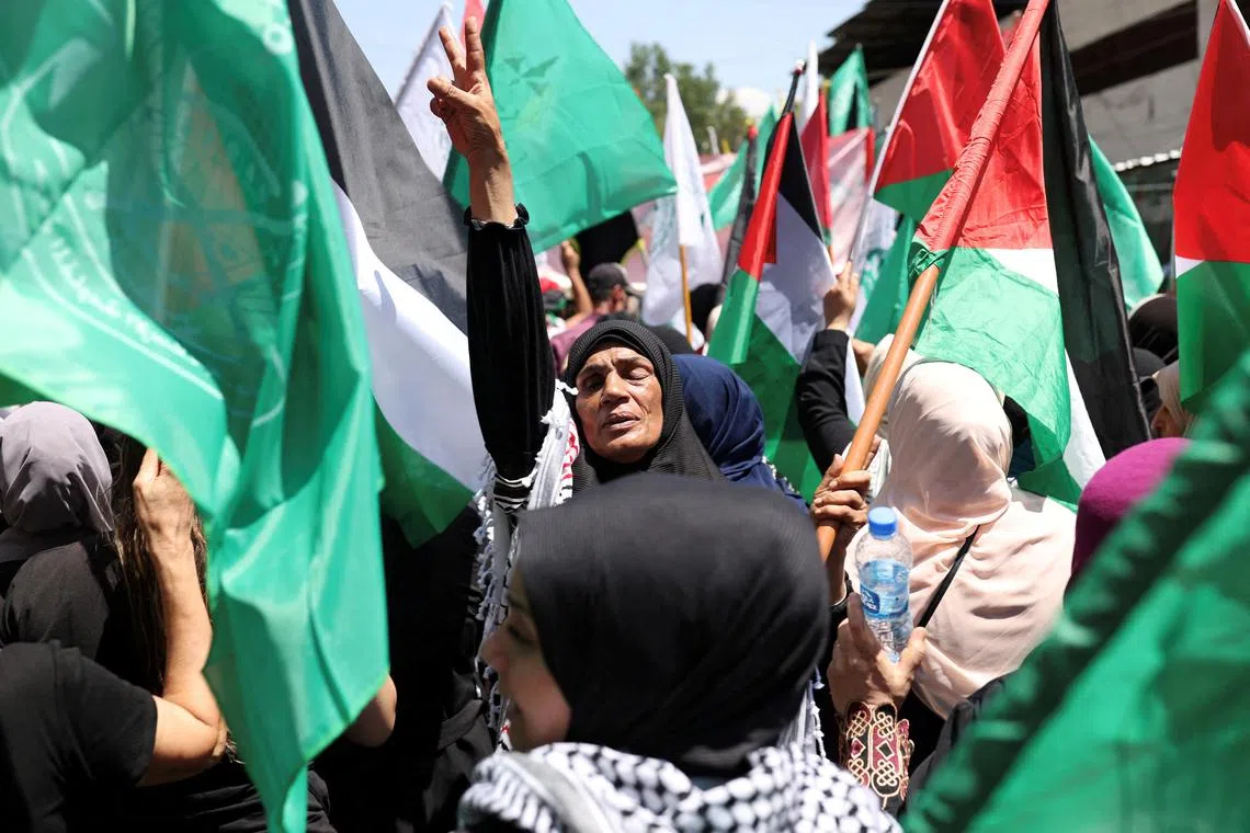 A demonstrator gestures during a protest against the killing of Hamas chief Ismail Haniyeh in Iran, in Beirut, Lebanon August 2, 2024. REUTERS/Emilie Madi