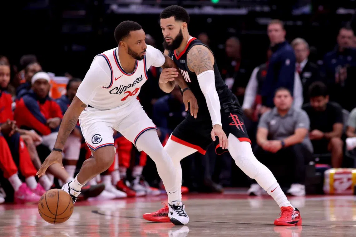Nov 13, 2024; Houston, Texas, USA; LA Clippers guard Norman Powell (24) handles the ball against Houston Rockets guard Fred VanVleet (5) during the third quarter at Toyota Center. Mandatory Credit: Erik Williams-Imagn Images/ File Photo