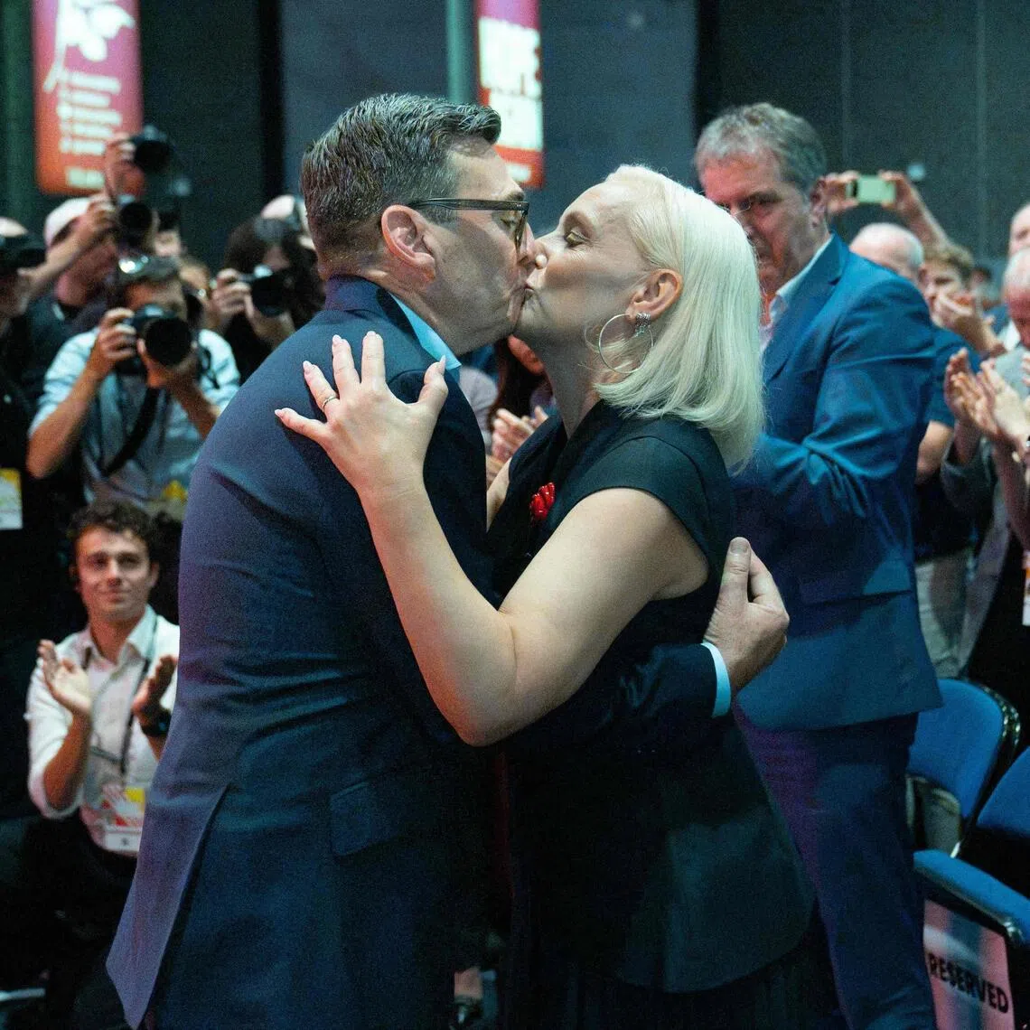 Britain’s PM Andy Burnham kisses his wife Marie-France after delivering his keynote speech on the third day of the Labour Party conference in Liverpool on Sept 29.