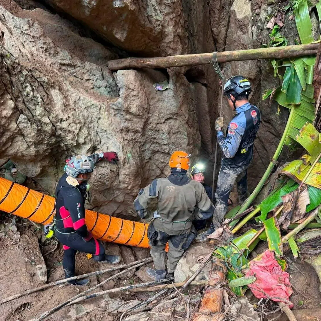 Members of a rescue team work to save seven people trapped in a cave in Xaisomboun province, Laos.
