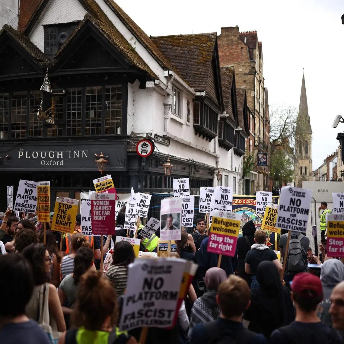 Demonstrators take part in a protest against a speech by British far-right activist Tommy Robinson, real name Stephen Yaxley-Lennon, on June 17.